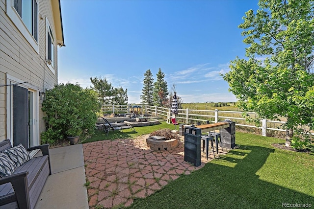 1248 Rawhide Cir, Elizabeth, CO 80107 - fenced backyard featuring a fire pit and a patio