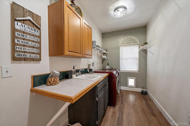 1248 Rawhide Cir, Elizabeth, CO 80107 - laundry area featuring cabinet space, separate washer and dryer, and wood finished floors