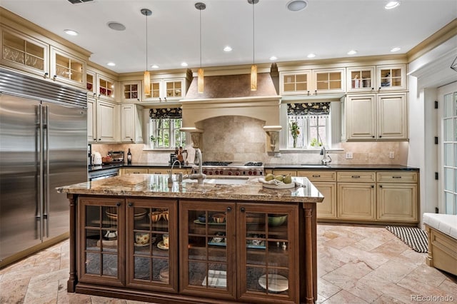 6300 E 17th Avenue Parkway, Denver, CO 80220 - kitchen with stainless steel built in fridge, a sink, stone tile flooring, recessed lighting, and backsplash