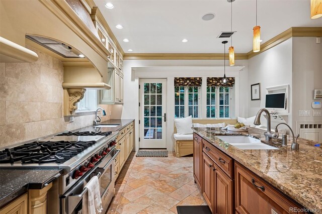 6300 E 17th Avenue Parkway, Denver, CO 80220 - kitchen featuring range with two ovens, a sink, stone tile flooring, pendant lighting, and recessed lighting