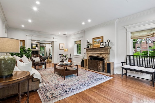 6300 E 17th Avenue Parkway, Denver, CO 80220 - living area featuring a fireplace with flush hearth, wood finished floors, recessed lighting, ornamental molding, and baseboards