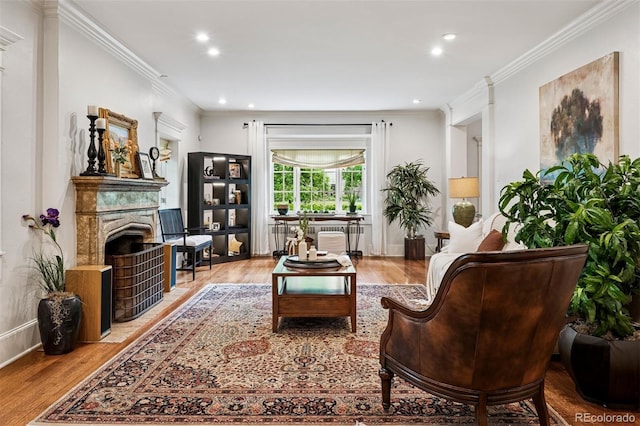 6300 E 17th Avenue Parkway, Denver, CO 80220 - living area featuring wood finished floors, a fireplace, crown molding, recessed lighting, and baseboards