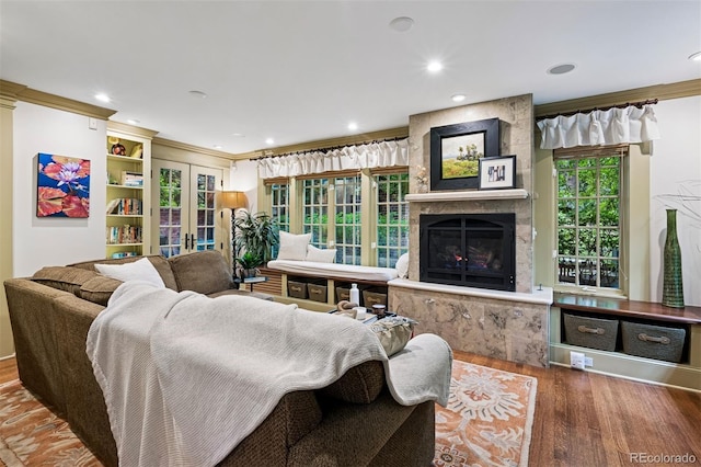 6300 E 17th Avenue Parkway, Denver, CO 80220 - living area with wood finished floors, a fireplace, french doors, recessed lighting, and crown molding