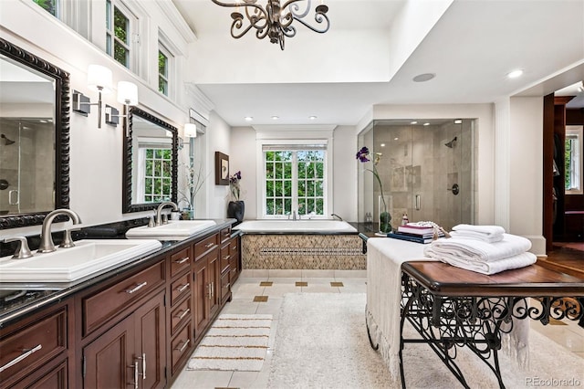 6300 E 17th Avenue Parkway, Denver, CO 80220 - full bathroom with a stall shower, a garden tub, double vanity, recessed lighting, and a chandelier