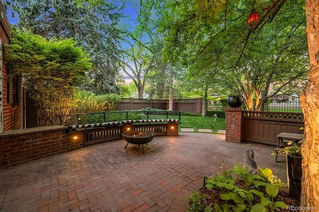 6300 E 17th Avenue Parkway, Denver, CO 80220 - fenced backyard featuring a fire pit and a patio