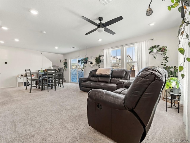 living room featuring ceiling fan and light colored carpet