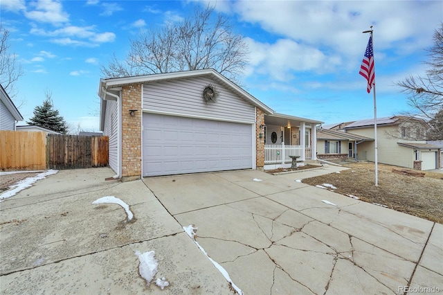 ranch-style house with a porch, a garage, brick siding, fence, and driveway