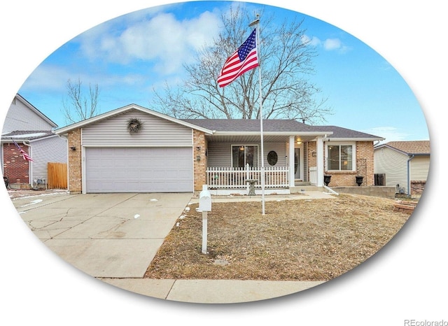 ranch-style house with an attached garage, covered porch, concrete driveway, and brick siding