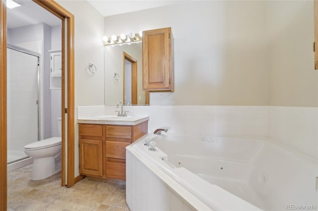 full bathroom with vanity, toilet, and separate shower and tub