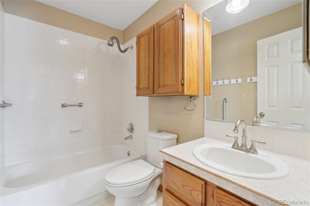 full bathroom with toilet, vanity, and bathing tub / shower combination