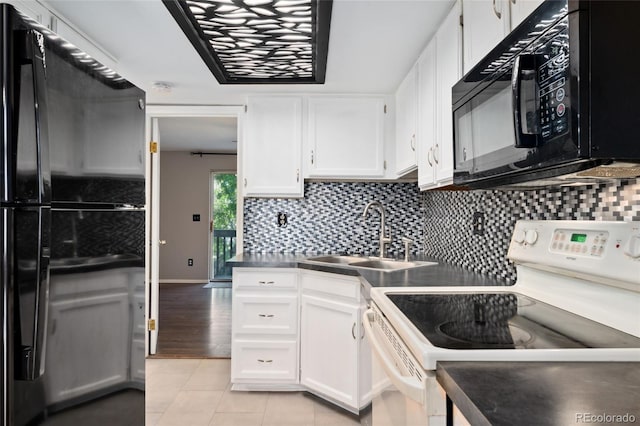 1885 S Quebec Way Unit A28, Denver, CO 80231 - kitchen featuring black appliances, a sink, light tile patterned floors, white cabinetry, and backsplash