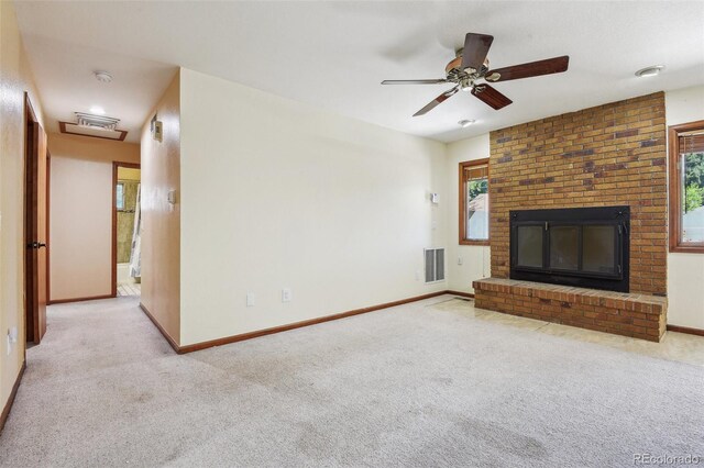 4720 S Grant St, Englewood, CO 80113 - unfurnished living room with carpet floors, a brick fireplace, plenty of natural light, and a ceiling fan