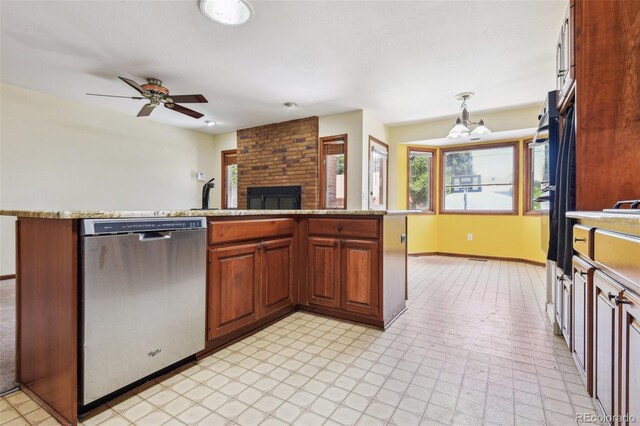 4720 S Grant St, Englewood, CO 80113 - kitchen with dishwasher, a ceiling fan, a fireplace, hanging light fixtures, and open floor plan