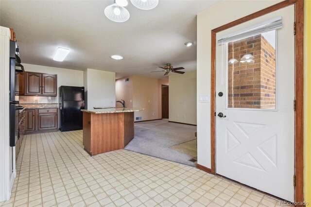 4720 S Grant St, Englewood, CO 80113 - kitchen with freestanding refrigerator, open floor plan, ceiling fan, light colored carpet, and recessed lighting