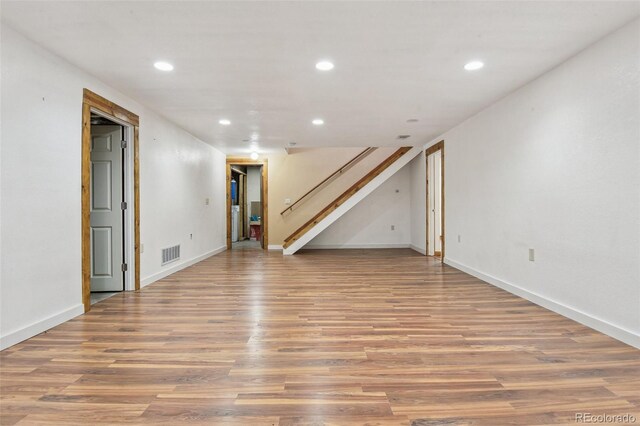 4720 S Grant St, Englewood, CO 80113 - unfurnished room featuring wood finished floors, recessed lighting, and stairway