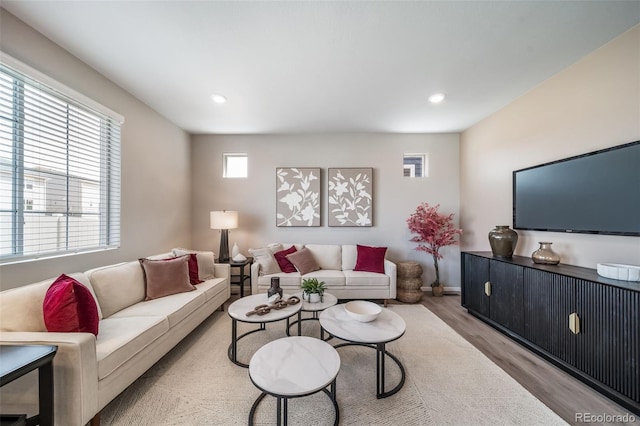 3879 N Shawnee St, Aurora, CO 80019 - living area featuring wood finished floors, recessed lighting, and baseboards