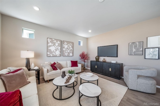 3879 N Shawnee St, Aurora, CO 80019 - living area featuring wood finished floors, baseboards, and recessed lighting