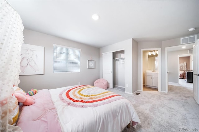 3879 N Shawnee St, Aurora, CO 80019 - bedroom with light carpet, baseboards, a closet, and connected bathroom