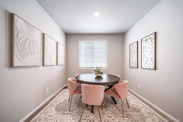 3879 N Shawnee St, Aurora, CO 80019 - dining area with baseboards and wood finished floors