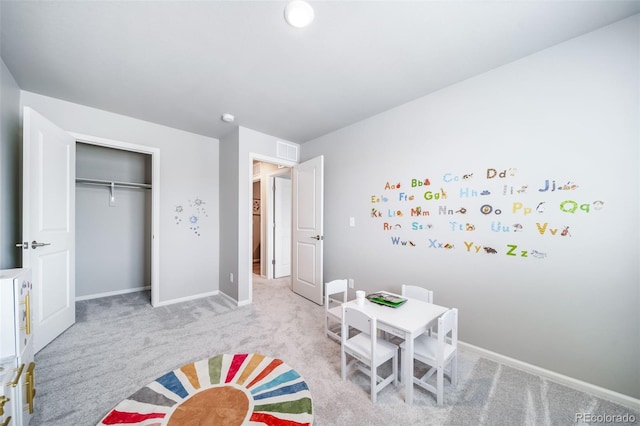 3879 N Shawnee St, Aurora, CO 80019 - rec room with light carpet and baseboards
