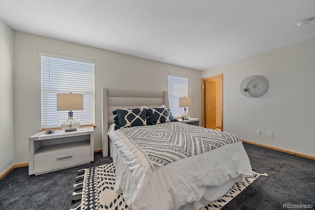 carpeted bedroom with a textured ceiling