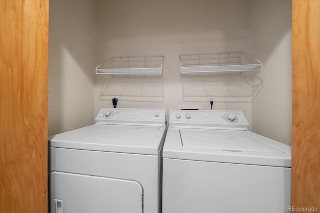 laundry area featuring washing machine and clothes dryer