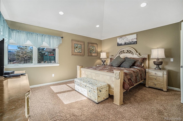 carpeted bedroom with lofted ceiling