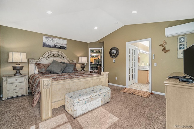 bedroom featuring ensuite bath, french doors, an AC wall unit, carpet floors, and lofted ceiling