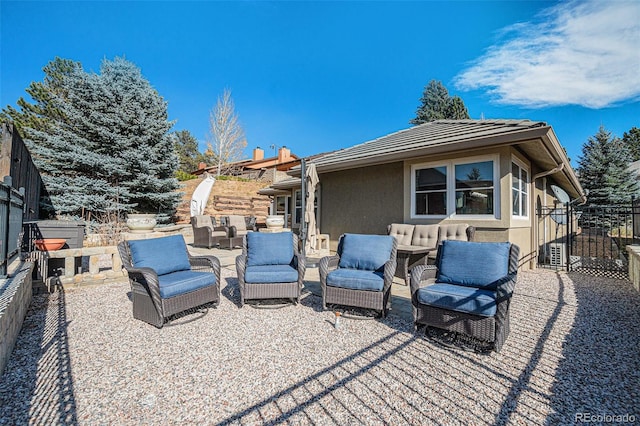 back of house featuring a patio and an outdoor hangout area