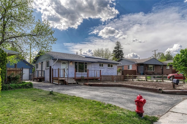 7541 Julian St, Westminster, CO 80030 - ranch-style house featuring roof mounted solar panels and brick siding