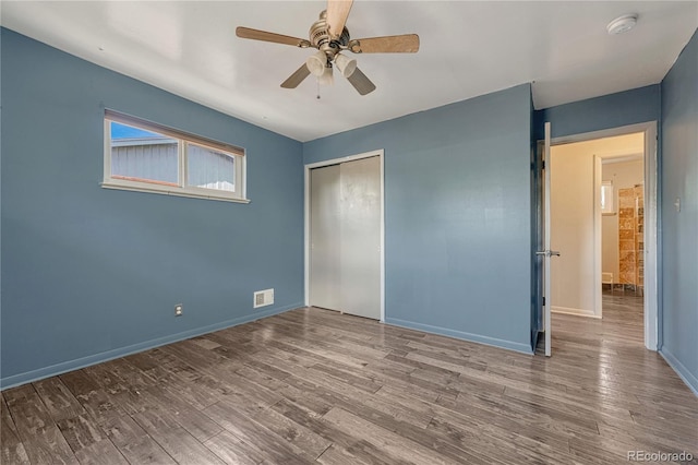 7541 Julian St, Westminster, CO 80030 - unfurnished bedroom featuring a closet, wood finished floors, baseboards, and a ceiling fan