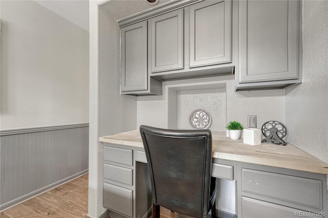 7541 Julian St, Westminster, CO 80030 - office space with built in study area, light wood-style floors, and baseboards