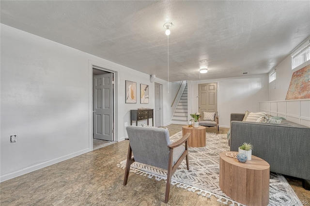 7541 Julian St, Westminster, CO 80030 - living room featuring stairs, a textured ceiling, and baseboards