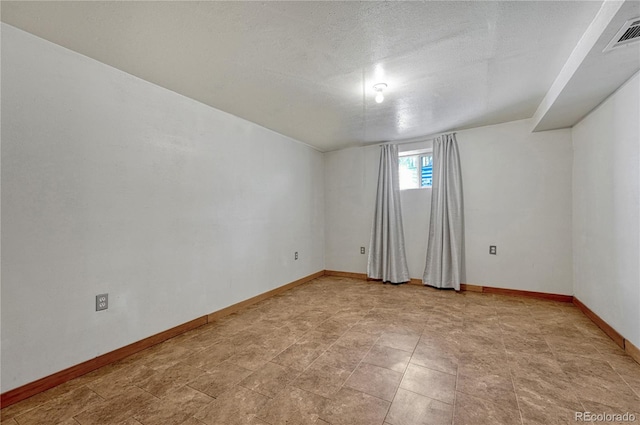 7541 Julian St, Westminster, CO 80030 - spare room with baseboards and a textured ceiling