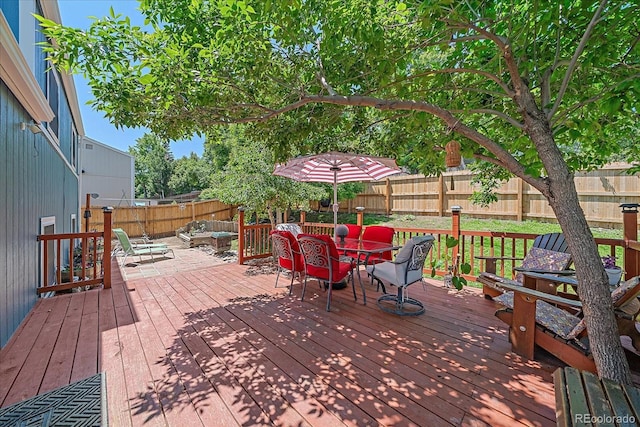 6085 S Parfet St, Littleton, CO 80127 - wooden deck with a fenced backyard and outdoor dining space