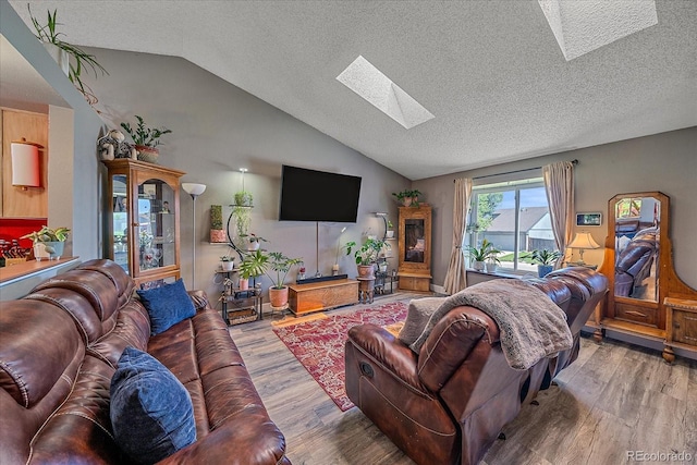 6085 S Parfet St, Littleton, CO 80127 - living area with a skylight, lofted ceiling, a textured ceiling, and wood finished floors