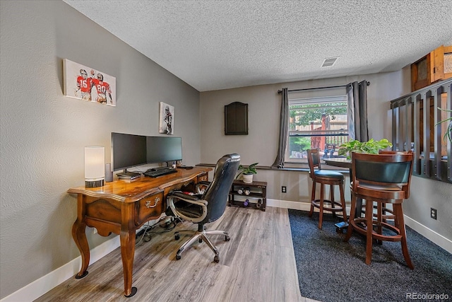6085 S Parfet St, Littleton, CO 80127 - office area with a textured ceiling and wood finished floors