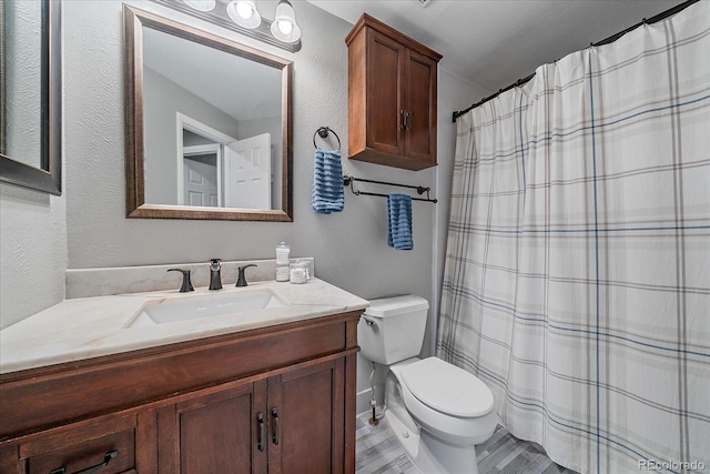 6085 S Parfet St, Littleton, CO 80127 - full bath with vanity, curtained shower, and a textured wall