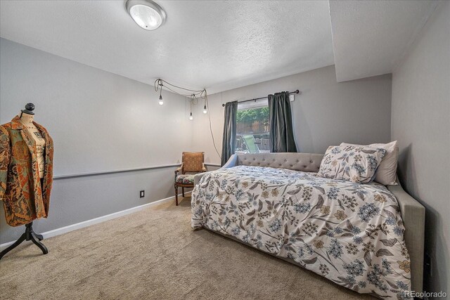 6085 S Parfet St, Littleton, CO 80127 - carpeted bedroom featuring a textured ceiling and baseboards