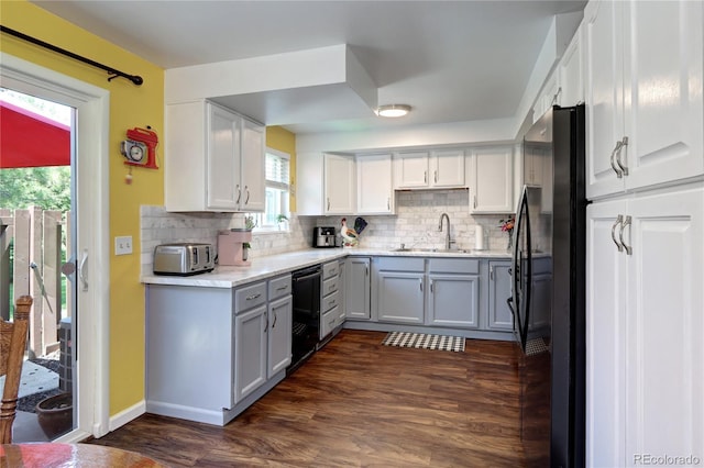 4856 E Hinsdale Pl, Centennial, CO 80122 - kitchen with freestanding refrigerator, black dishwasher, tasteful backsplash, and gray cabinetry