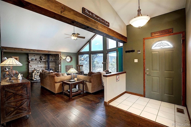 entryway featuring wood-type flooring, ceiling fan, and vaulted ceiling