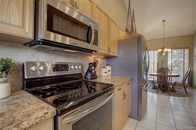 kitchen with light brown cabinetry, tasteful backsplash, and stainless steel appliances