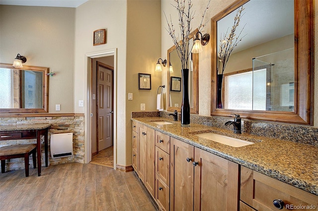 bathroom with hardwood / wood-style flooring and vanity