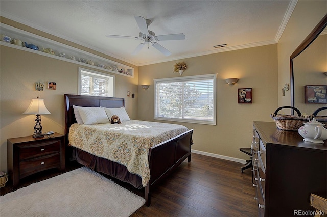 bedroom with dark wood-type flooring, ceiling fan, and ornamental molding