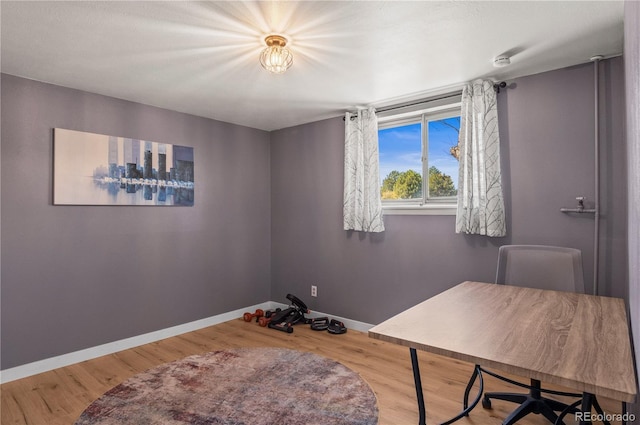 office with wood finished floors and baseboards
