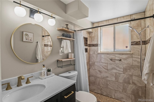 full bathroom with toilet, a stall shower, and vanity