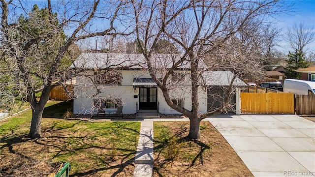 view of front of house with fence