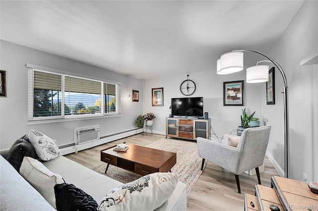 living room with a wall mounted AC and light wood-type flooring