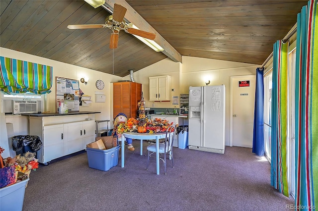 kitchen with vaulted ceiling with beams, cooling unit, white refrigerator with ice dispenser, white cabinetry, and ceiling fan