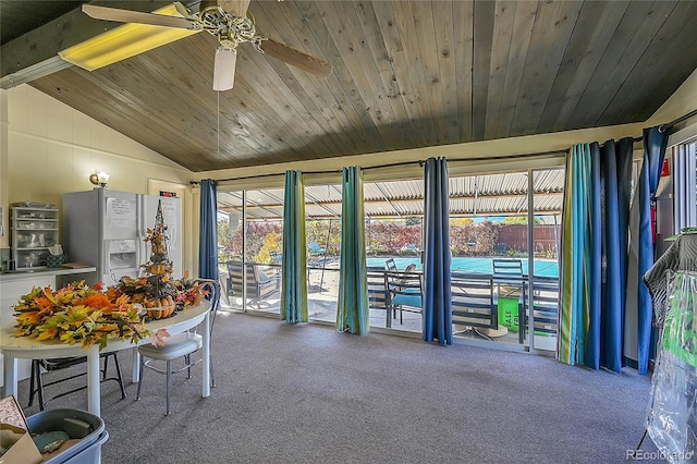 unfurnished sunroom with vaulted ceiling, wood ceiling, and ceiling fan